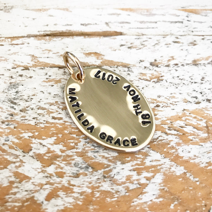 HAND STAMPED GOLD OVAL PENDANT