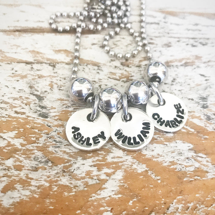 HAND STAMPED SILVER TOKEN PENDANTS