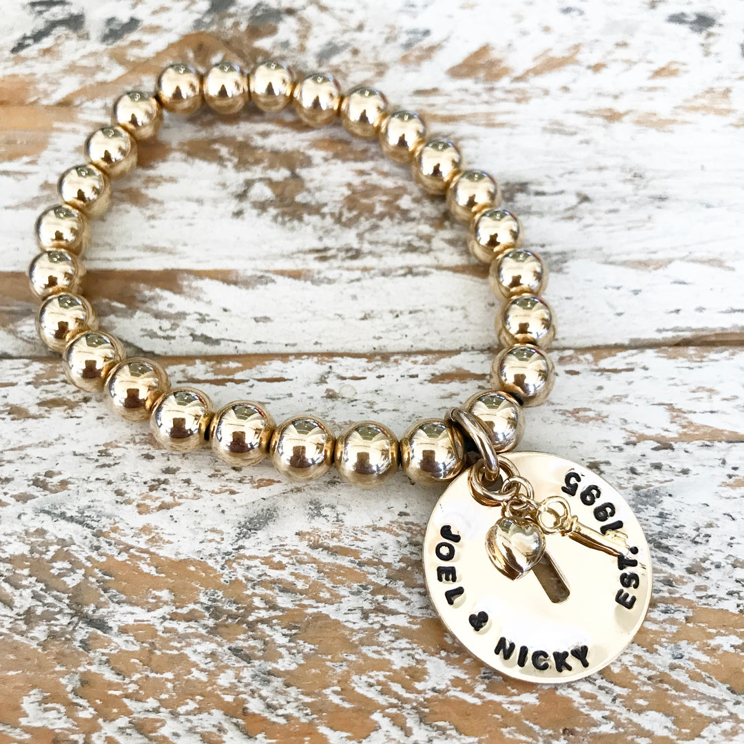 HAND STAMPED GOLD KEYHOLE PENDANT