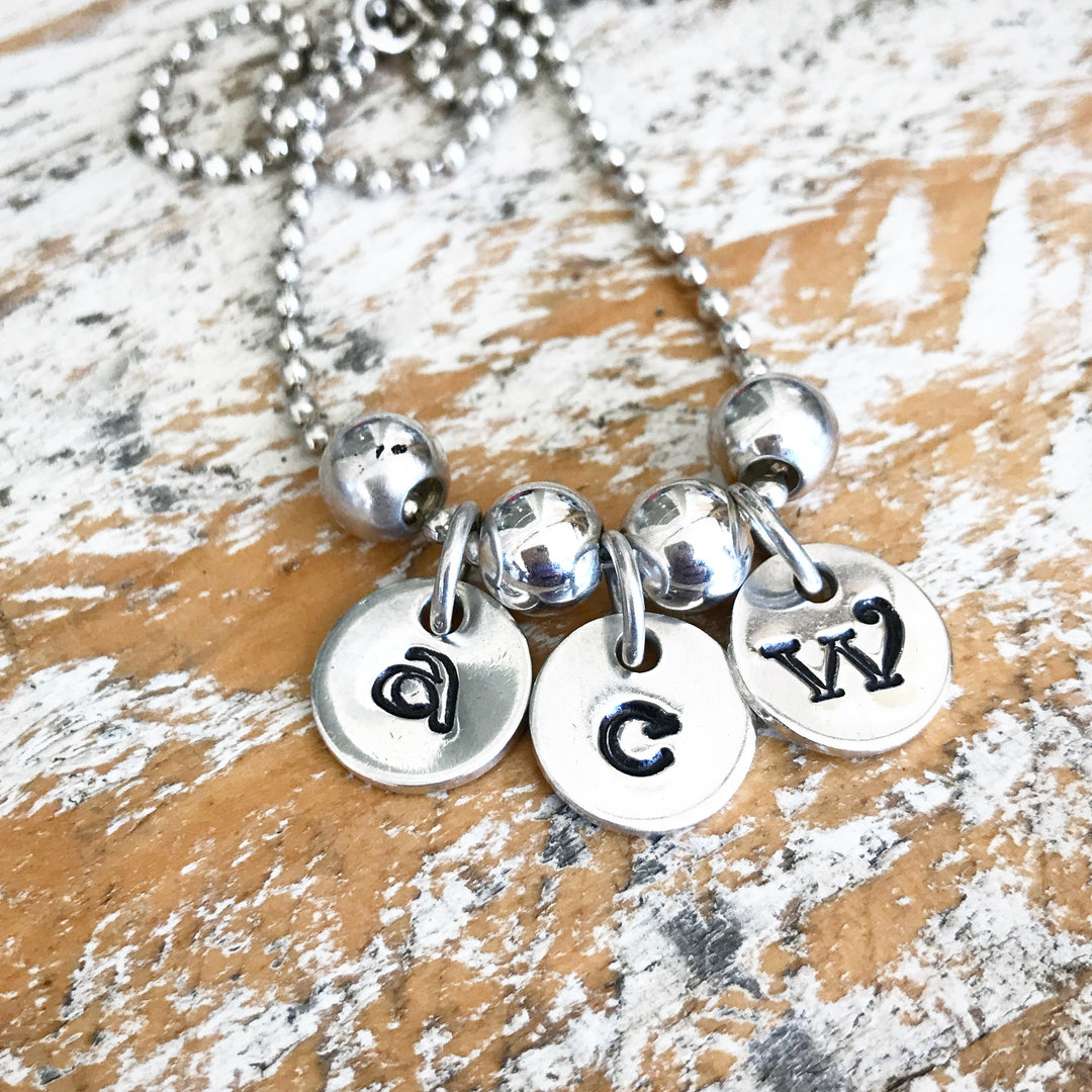 HAND STAMPED SILVER TOKEN PENDANTS