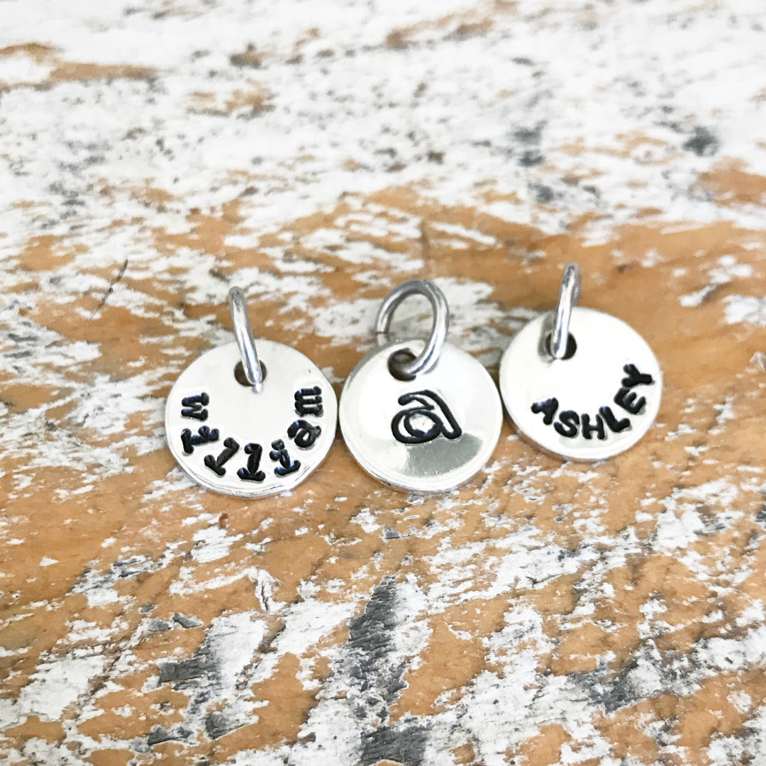 HAND STAMPED SILVER TOKEN PENDANTS