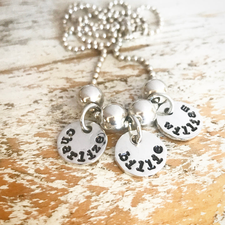 HAND STAMPED SILVER TOKEN PENDANTS